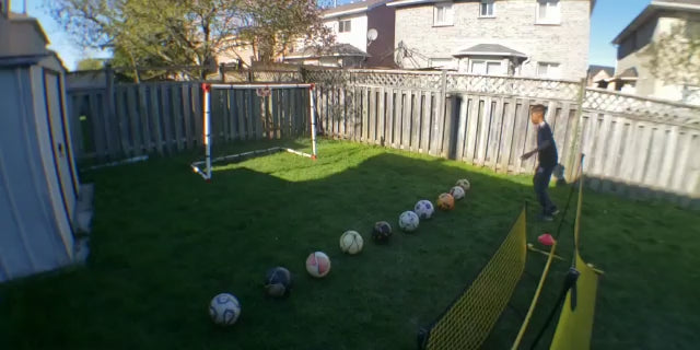 Load video: A youth shooting multiple balls at his 7-year old Eznet in his backyard, demonstrating its functionality and durability.